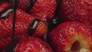 Download Free Video Stock texture of strawberries covered with chocolate syrup Live Wallpaper