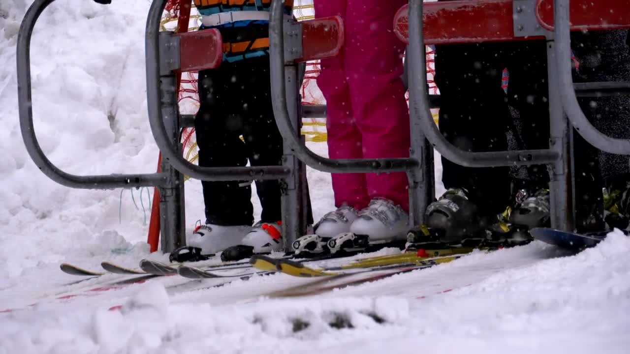 Download Free Video Stock the skiers getting ready to board the ski lift Live Wallpaper