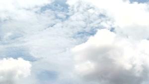 Download Free Video Stock thick white clouds above a city Live Wallpaper