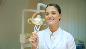 Download Free Video Stock thumb up of a dentist showing toothbrushes Live Wallpaper
