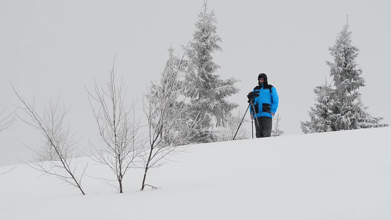 Download Free Video Stock time lapse of a photographer in the snow Live Wallpaper