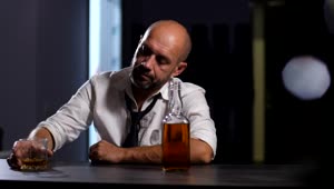 Download Free Video Stock tired man drinking whisky Live Wallpaper