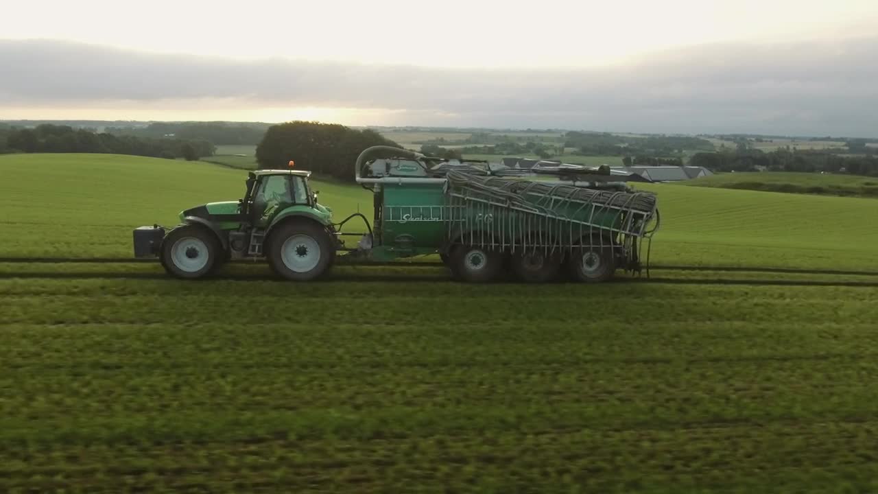 Download Free Video Stock tractor pulling a water tank Live Wallpaper