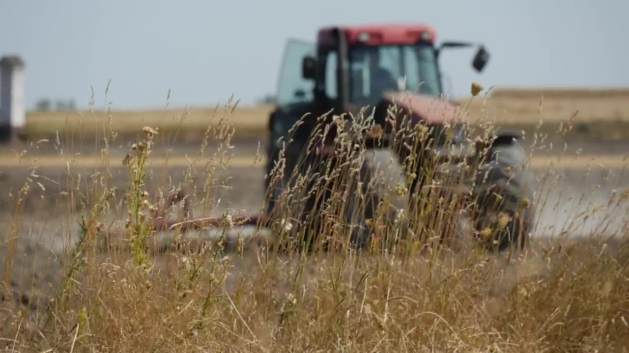 Download Free Video Stock tractor working on the agricultural field Live Wallpaper