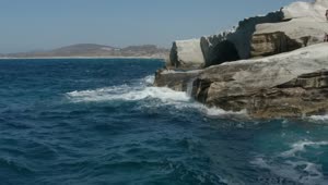 Download Free Stock Video Waves Hitting A Rocky Cliff In Greece Live Wallpaper