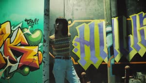 Download Free Stock Video Urban Woman Near Wall With Graffiti Live Wallpaper