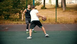 Download Free Stock Video Two Men Playing Basketball In A Park Live Wallpaper
