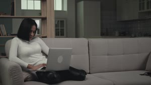 Download Free Stock Video Young Woman Using Laptop In The Couch Live Wallpaper