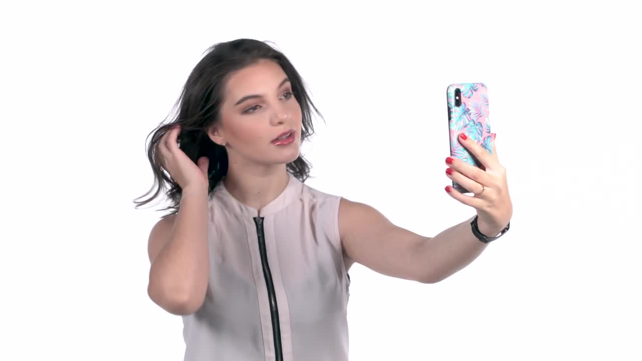 Download Free Stock Video Young Woman Takes Selfies With A Smartphone Live Wallpaper