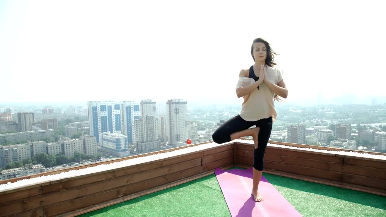 Download Free Stock Video Young Woman Practicing Yoga In The Rooftop Live Wallpaper