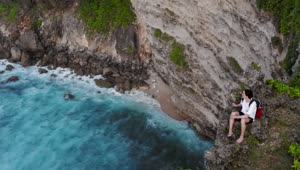 Download Free Stock Video Young Wanderlust Sees The Ocean From A Cliff Live Wallpaper