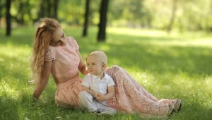 Download Free Stock Video Young Mother Caresses Her Son In The Park Live Wallpaper