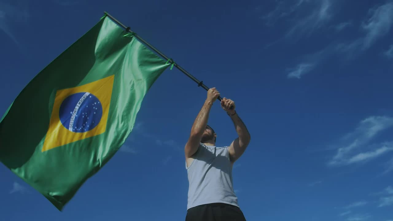 Download Free Stock Video Young Man Waving The Flag Of Brazil Live Wallpaper