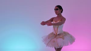 Download Free Stock Video Young Ballerina Doing Movements On A Colorful Background Live Wallpaper