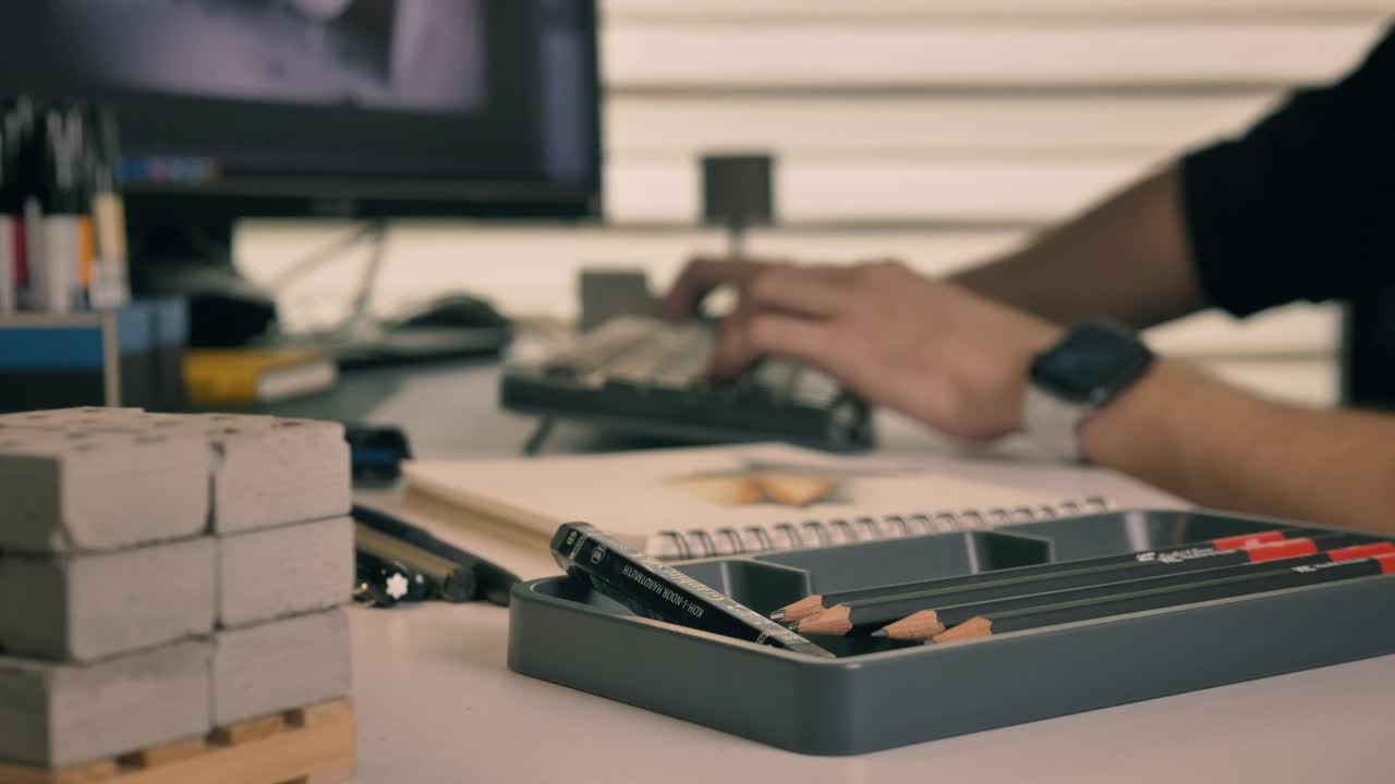 Download Free Stock Video Working On A Computer Surrounded By Artifacts For Drawing Live Wallpaper