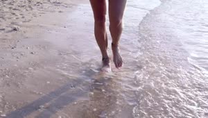 Download Free Stock Video Womans Feet Walking Along The Shore Of The Beach Live Wallpaper