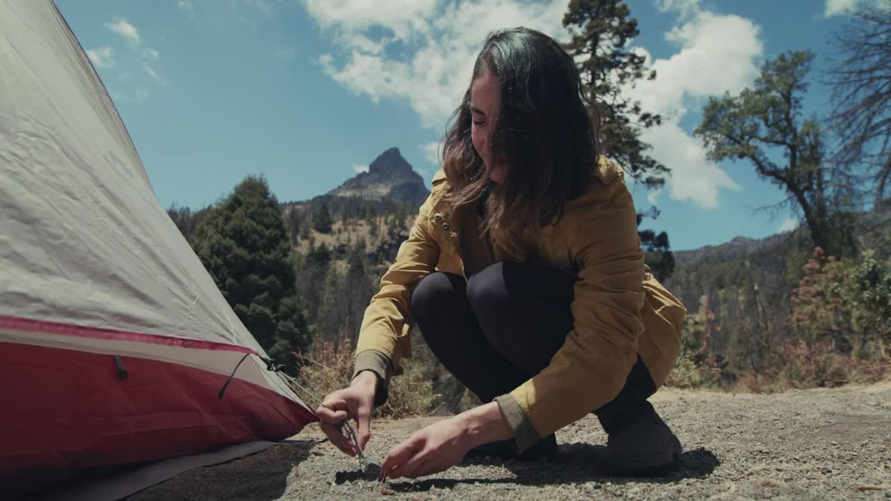 Download Free Stock Video Woman Tying Her Tent To A Nail Live Wallpaper