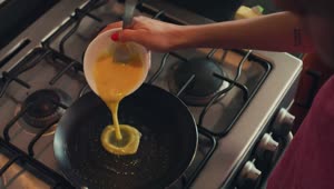 Download Free Stock Video Woman Serving Eggs In A Pan For Breakfast Live Wallpaper