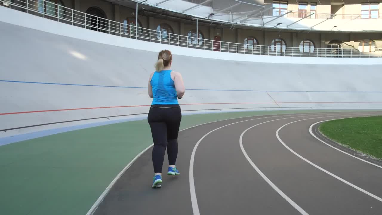 Download Free Stock Video Woman Running On A Running Track Live Wallpaper