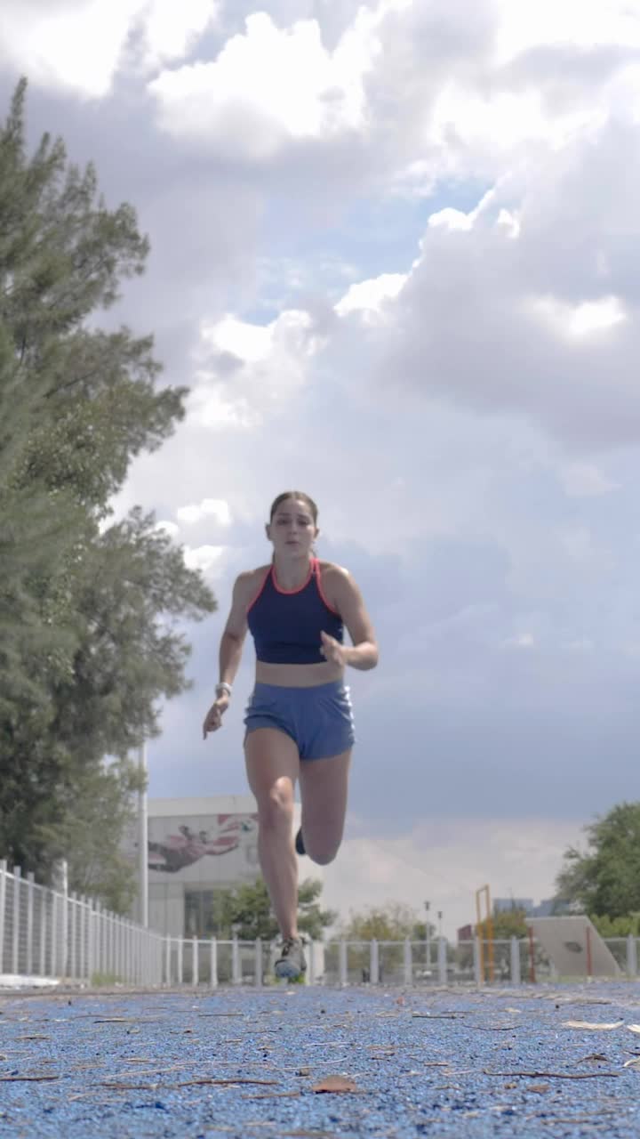 Download Free Stock Video Woman Running Above The Camera On A Running Track Live Wallpaper