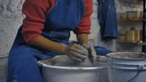 Download Free Stock Video Woman In A Pottery Workshop Working With Clay Live Wallpaper
