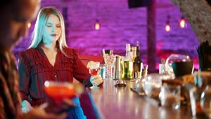 Download Free Stock Video Woman In A Bar Turns To See A Distracted Man Live Wallpaper