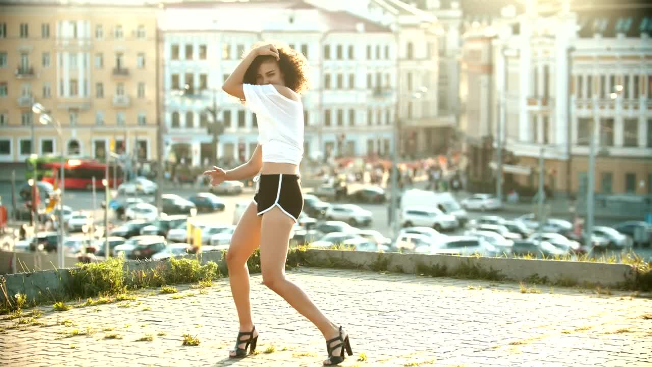 Download Free Stock Video Woman Dancing On The Roof Of A Building Live Wallpaper