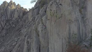 Download Free Stock Video Woman Climbing A Gigantic Rocky Mountain Live Wallpaper