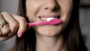 Download   Stock Footage Woman Brushing Her Teeth Live Wallpaper