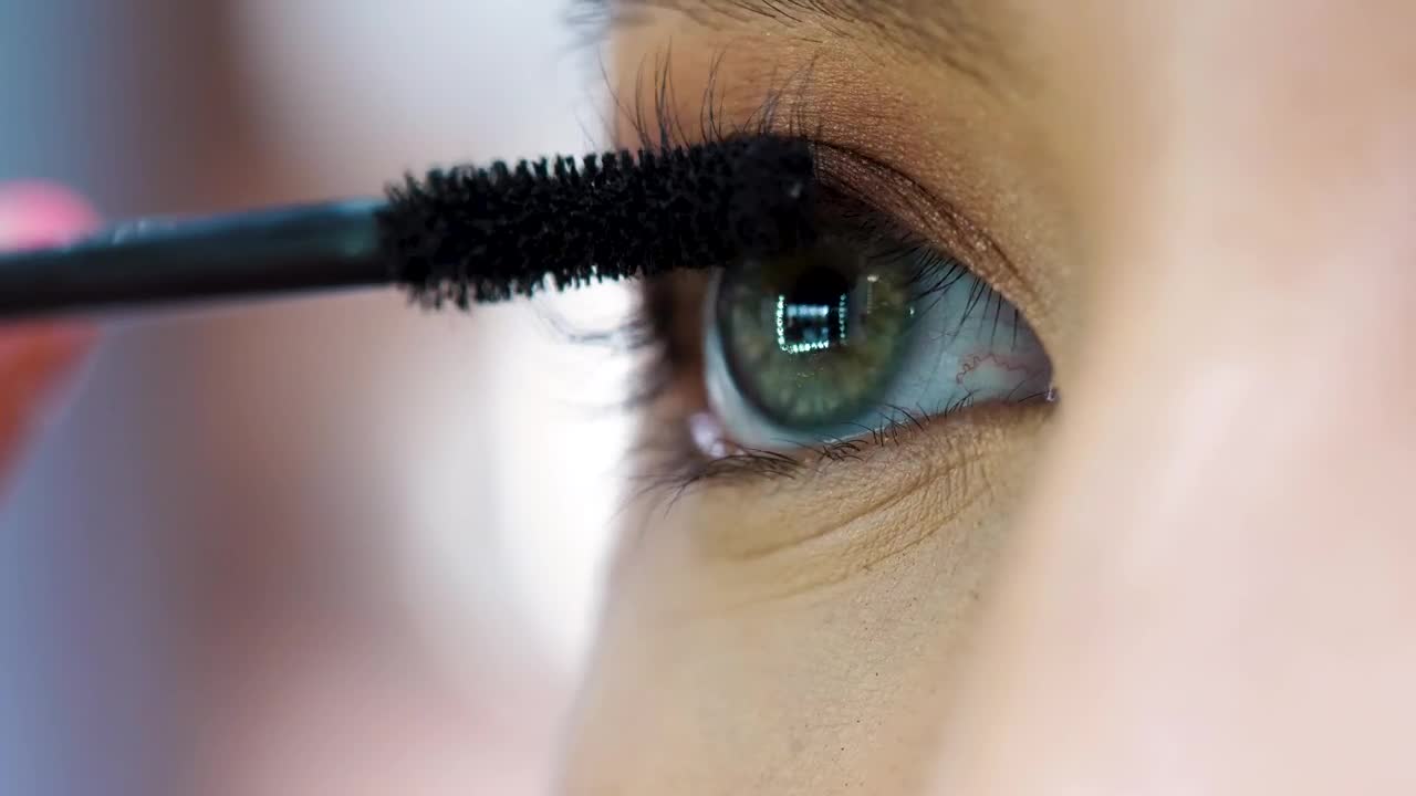 Download   Stock Footage Woman Applying Mascara In Her Eyes Live Wallpaper