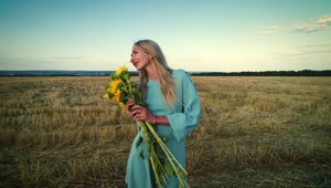 Download   Stock Footage Woman And Sunflowers In The Countryside Live Wallpaper