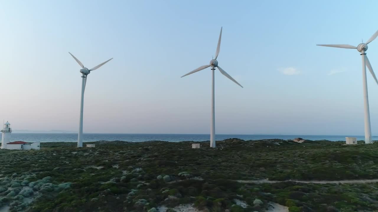 Download   Stock Footage Wind Turbines Next To A Lighthouse Live Wallpaper