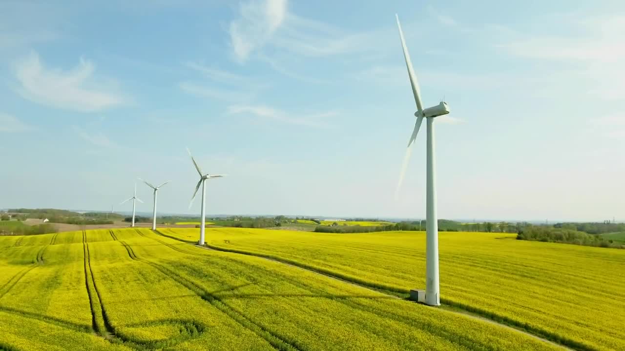 Download   Stock Footage Wind Turbines In A Field Live Wallpaper