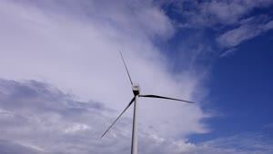Download   Stock Footage Wind Turbine Off Under A Cloudy Sky Live Wallpaper