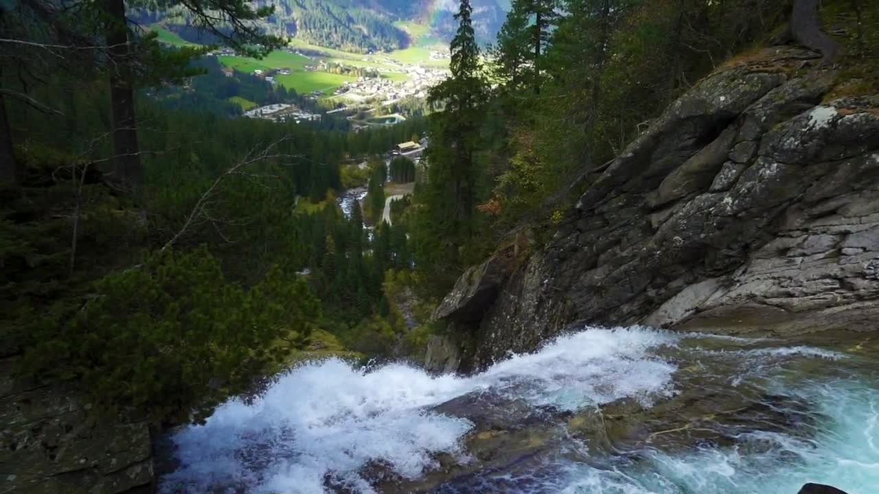 Download   Stock Footage Waterfall In The Forest With A Town And A Rainbow Live Wallpaper