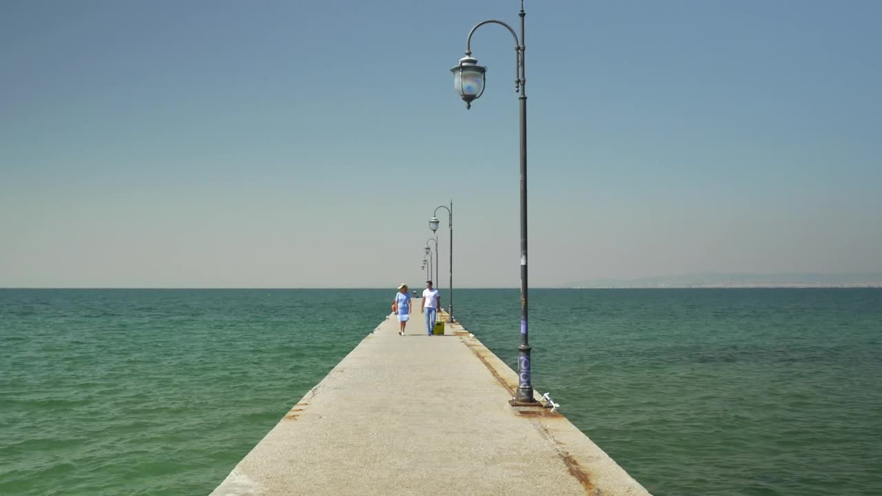 Download   Stock Footage Walking Along A Concrete Pier Live Wallpaper