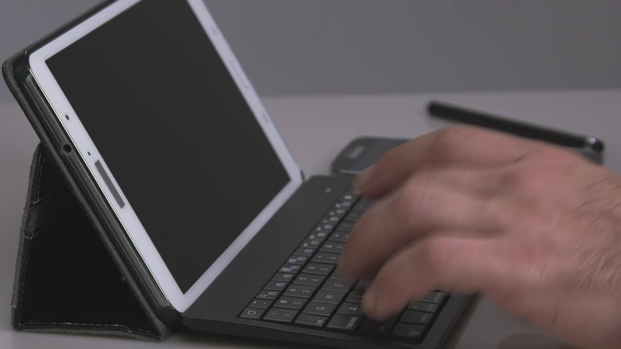 Download   Stock Footage Using A Keyboard With A Tablet Live Wallpaper