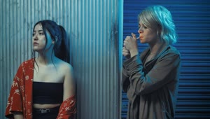 Download   Stock Footage Urban Woman Shares Her Cigarette With Her Friend Live Wallpaper
