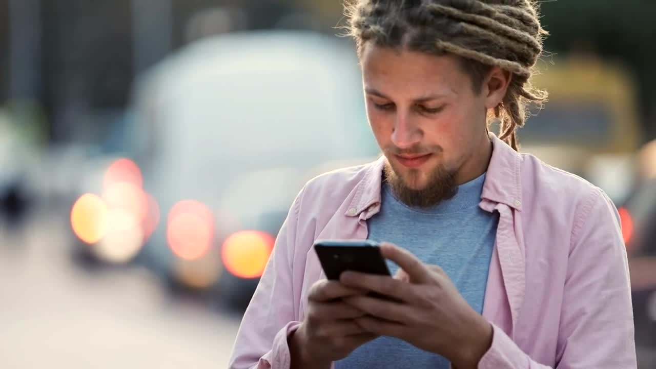 Download   Stock Footage Urban Man Smiles At Social Media App In Street Live Wallpaper