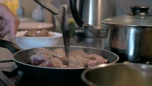 Download   Stock Footage Turning Meat In A Frying Pan Live Wallpaper