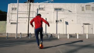 Download Stock Footage Young Man Playing Soccer In The Street Live Wallpaper Free
