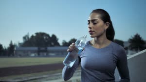 Download Stock Footage Woman Drinks From Water Bottle Live Wallpaper Free