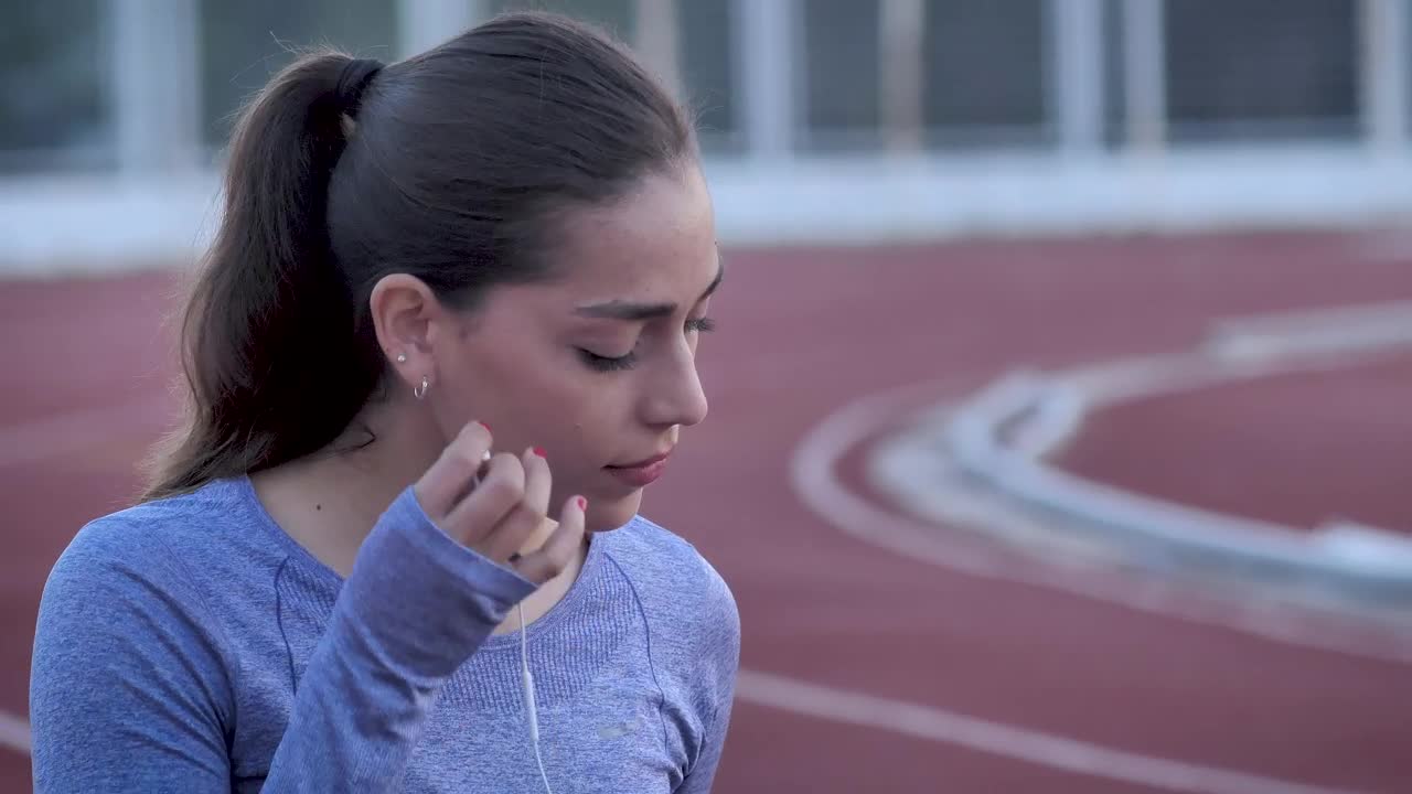 Download Stock Footage Woman Preparing To Run On A Track Live Wallpaper Free