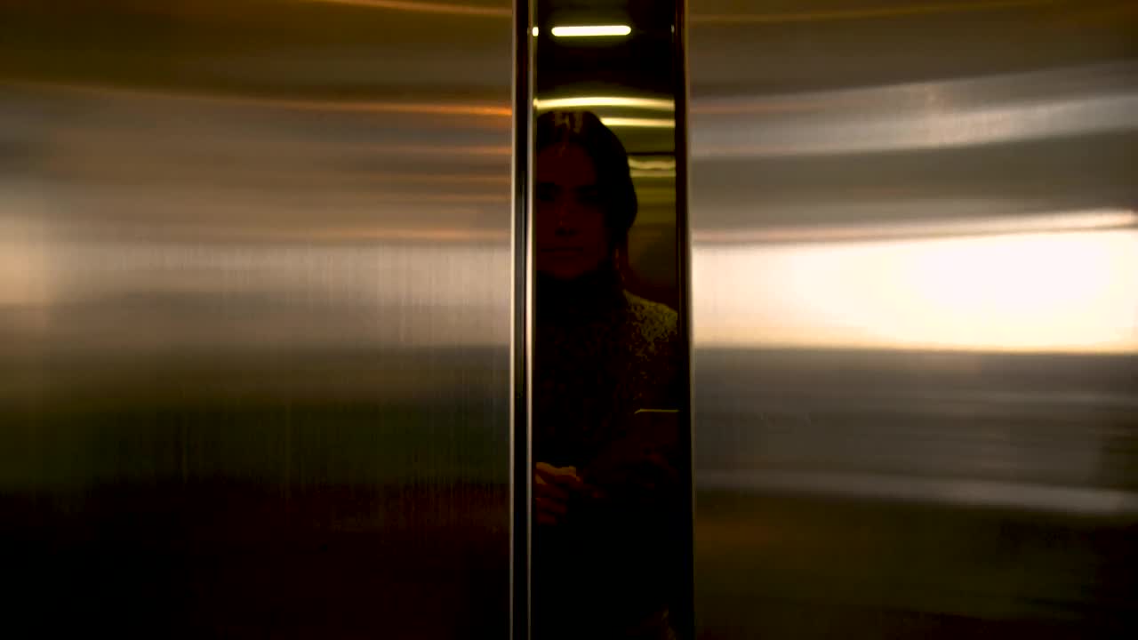 Download Stock Footage Woman Exits An Elevator Live Wallpaper Free