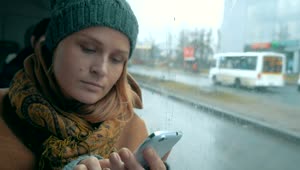 Download Stock Footage Woman Using Her Phone On A Rainy Day Live Wallpaper Free
