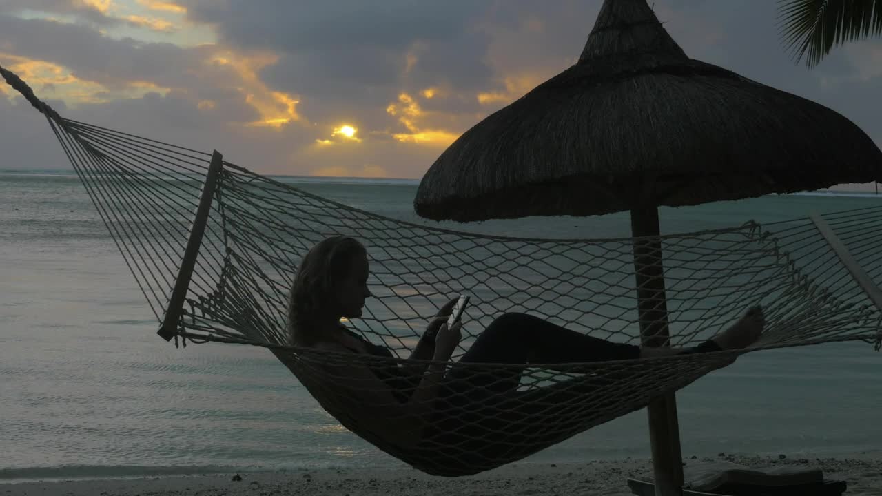 Download Stock Footage Woman Relaxing In A Hammock Live Wallpaper Free