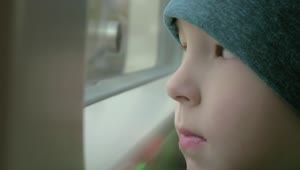 Download Stock Footage Young Boy Looking Out Of A Train Window Live Wallpaper Free