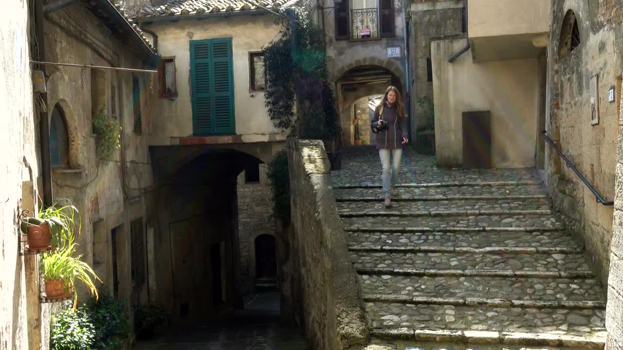 Download Stock Footage Woman Walking Down The Stairs Of An Ancient City Live Wallpaper Free