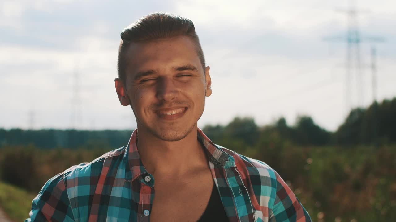 Download Stock Footage Young Man With An Open Shirt Smiling Live Wallpaper Free