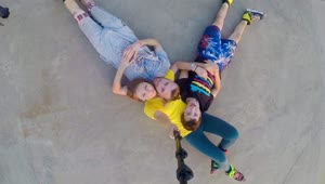 Download Stock Footage Young Family In Rollerskates Laying On The Ground Live Wallpaper Free